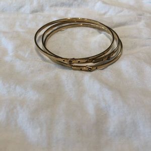 Gold Michael Kors 3 buckle bangles